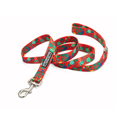 Red holiday dog leash with a pattern of Nutcrackers, holly, and green Christmas ornaments.