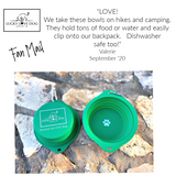 A marketing graphic featuring a customer testimonial from Valerie above two green, collapsible silicone dog bowls resting on a rocky outdoor surface.