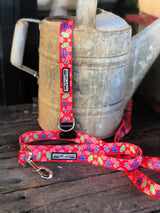 red christmas dog collar and leash with mittens and snowflakes on vintage watering can