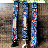 blue winter dog collar and dog leash on fence