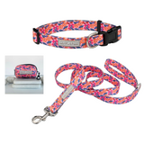 Bright floral dog collar, leash, and matching waste bag holder from Lucky Love Dog.