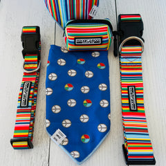 Hippie bandana for dogs showing the blue retro peace sign pattern side, displayed next to matching rainbow striped dog collars and a pouch with the product description page.