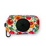 Floral dog waste bag holder by Lucky Love Dog Austin, featuring a secure clip and a large black dispenser opening.