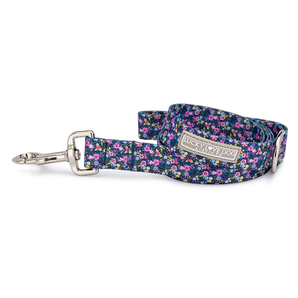 Lucky Love Dog featuring a vibrant ditsy flower pattern and a silver metal clasp on a white background.