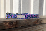 purple floral dog collar on fence