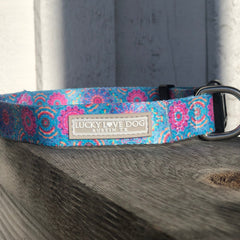 pink and blue boho dog collar with buckle on fence